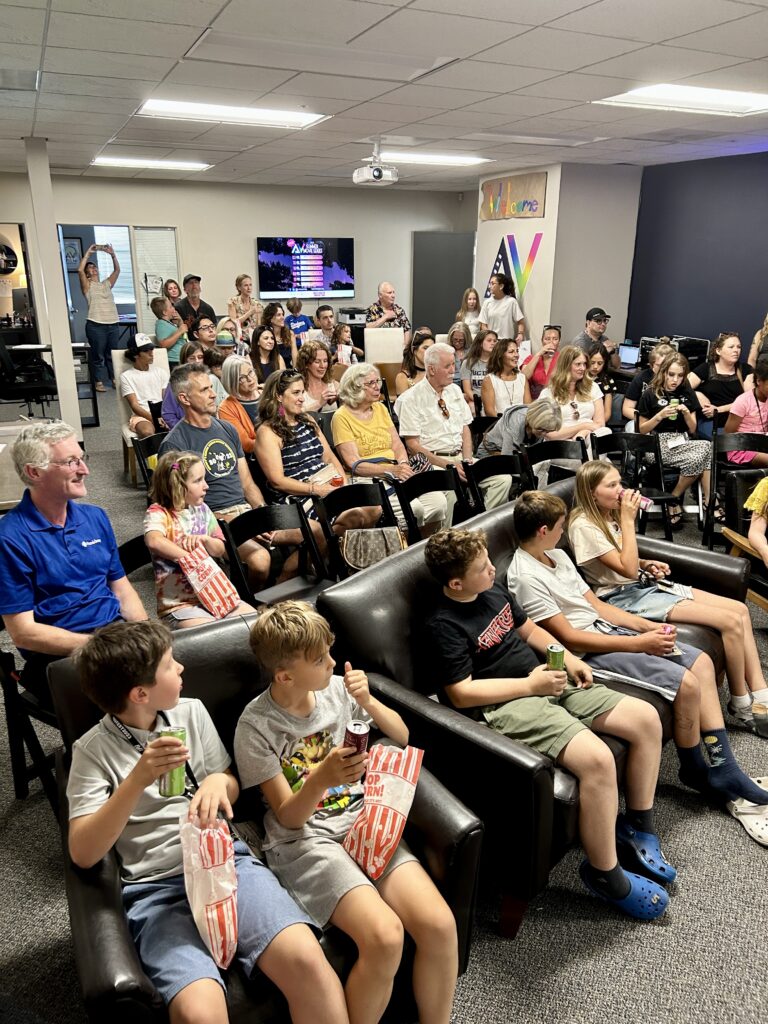 A group of parents watches student films for AVFilm Summer Camp final presentation in Healdsburg.
